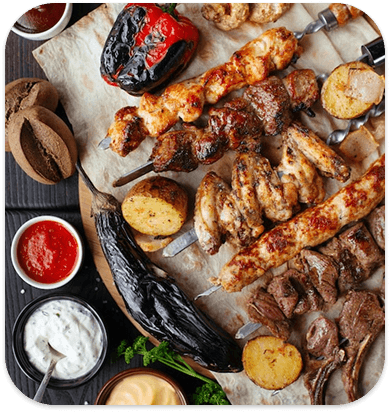 Grilled meat with sides and sauces